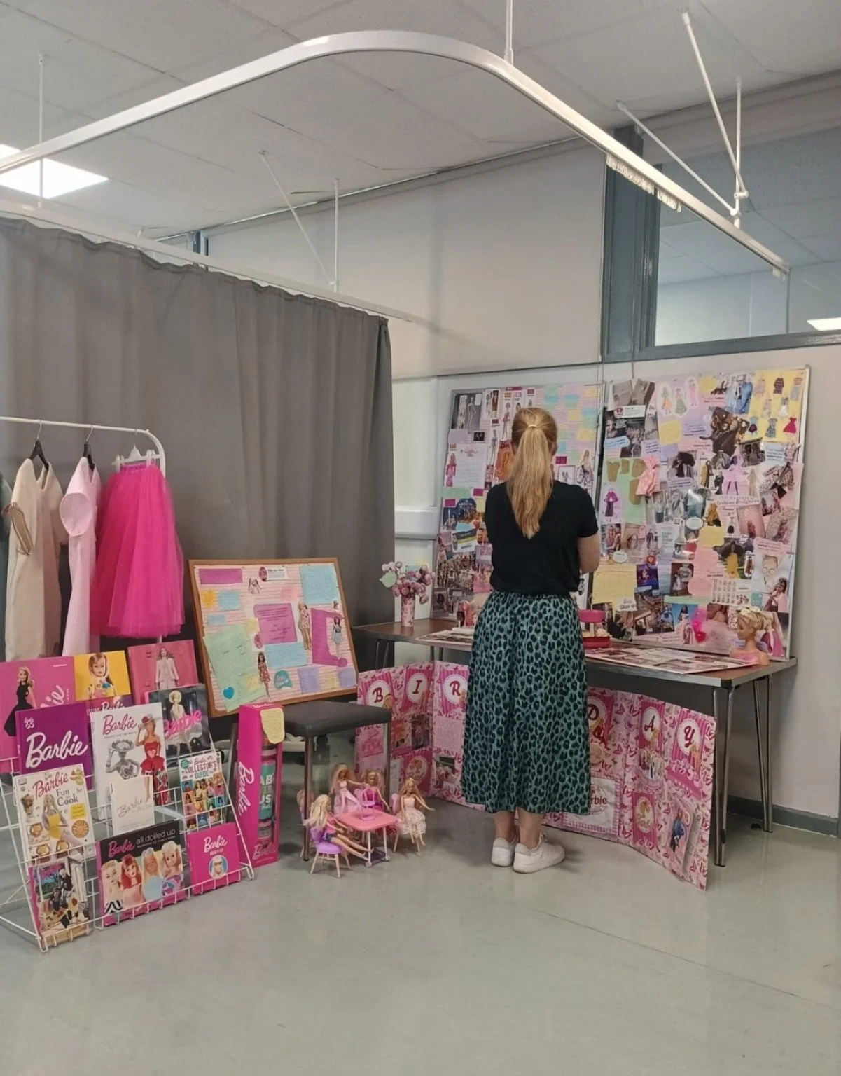 Lisa looking at Helena Mueller’s large Barbie-themed Creative Image college project display.
