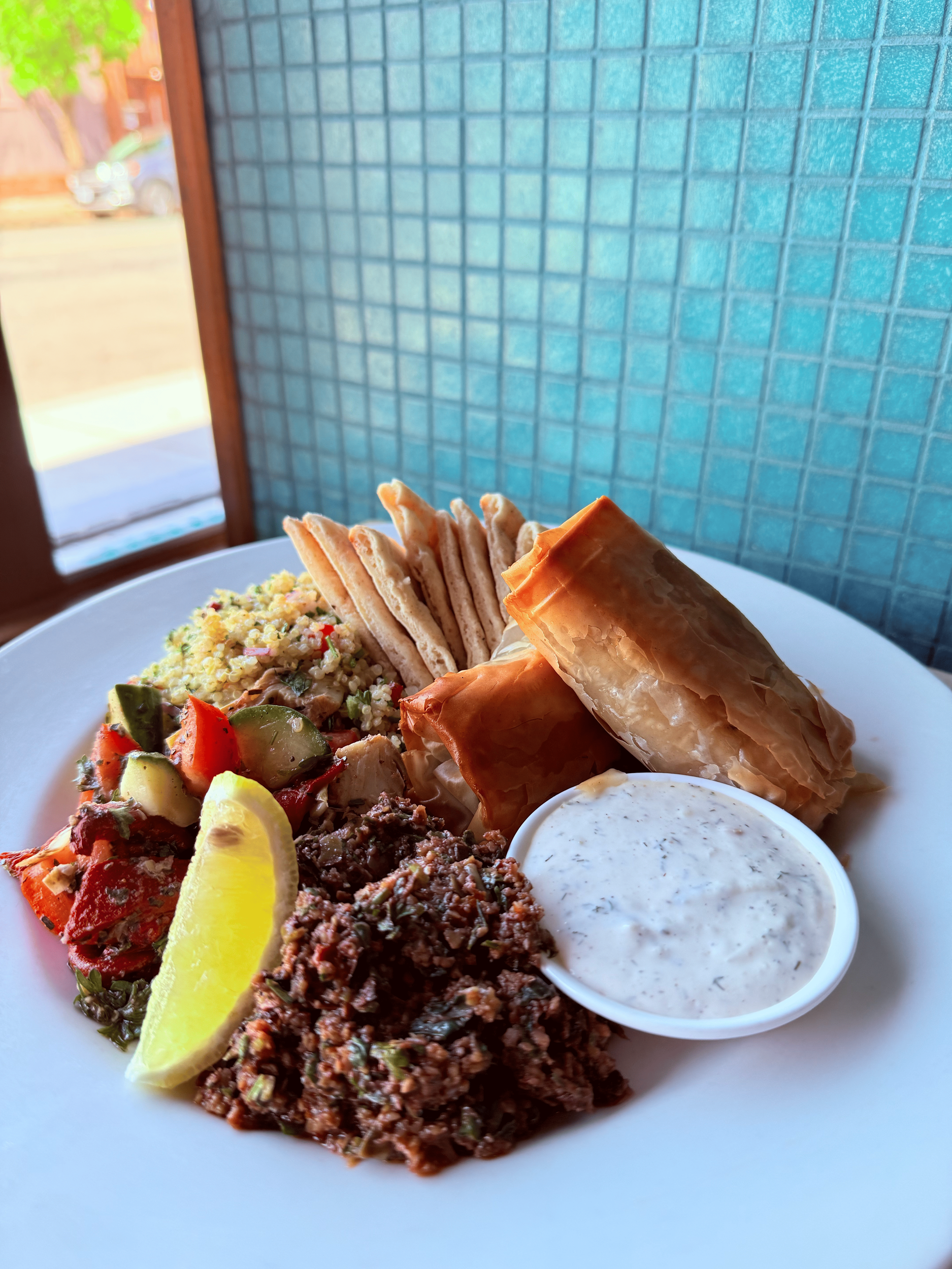 Mezze Platter
Spanakopita, dill yogurt, marinated veggies, tapenade, pita, quinoa tabbouleh.
