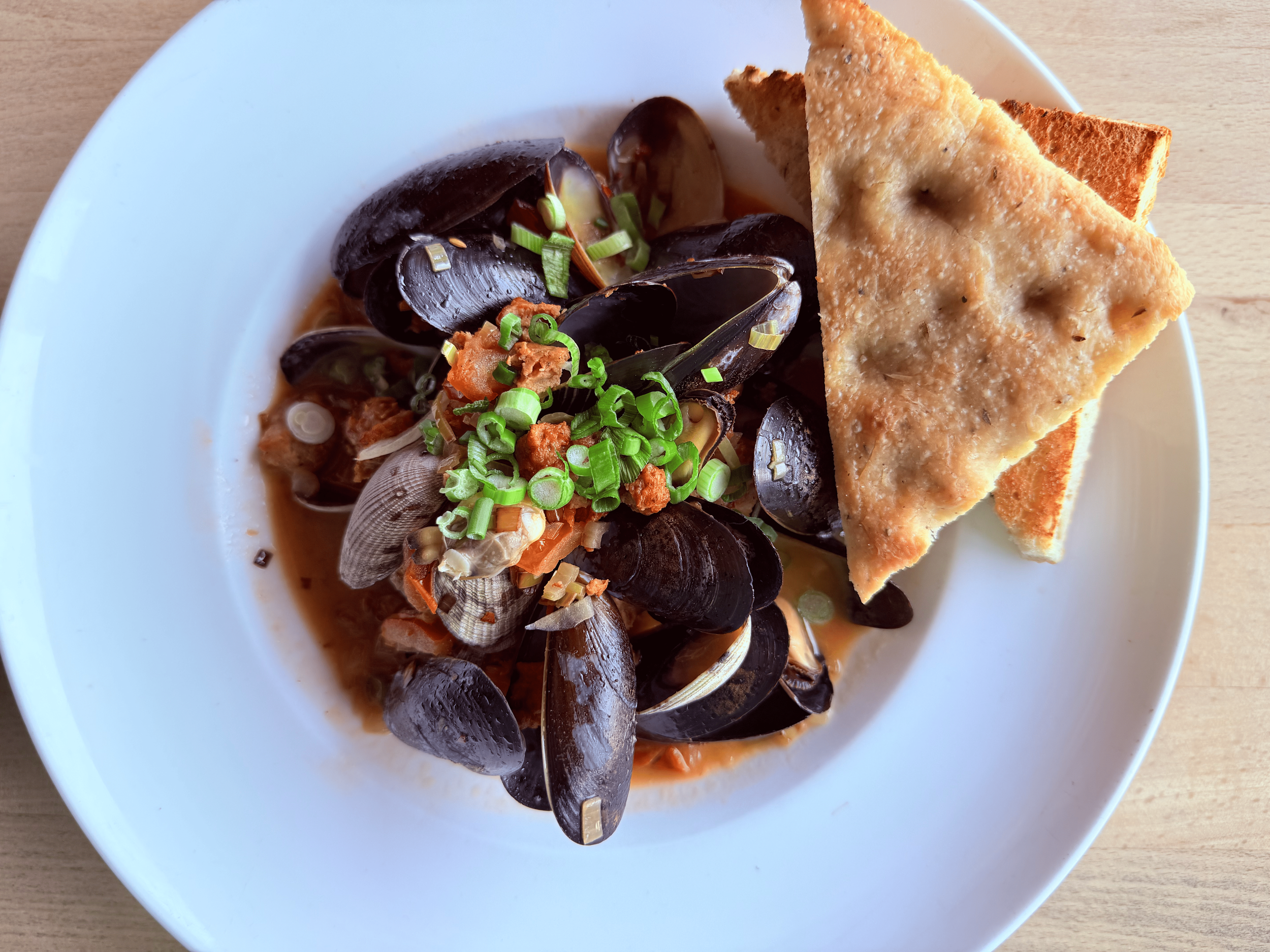 Shellfish & Toast
Fresh clams & mussels, spiced sausage, tomato, white wine butter sauce.