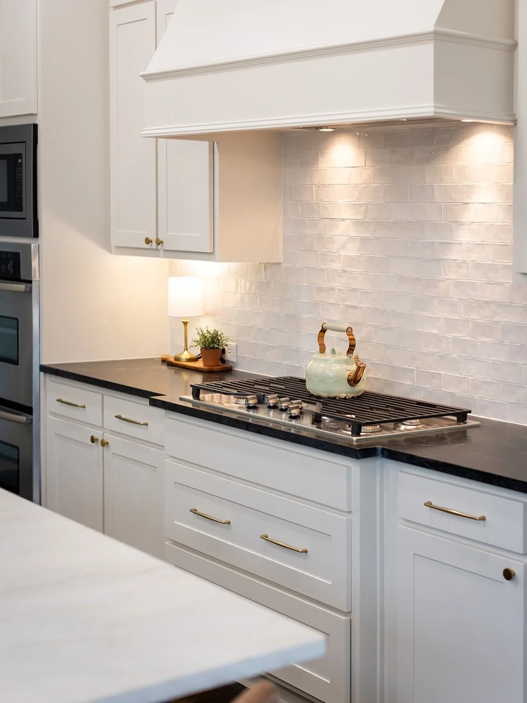 This client wanted a Zellige look, but wasn&rsquo;t sold on the thicker tiles. We found the perfect alternative! WOW Design&rsquo;s Fez Collection tile in white gave us the perfect amount of movement and texture, keeping this kitchen practical, beaut