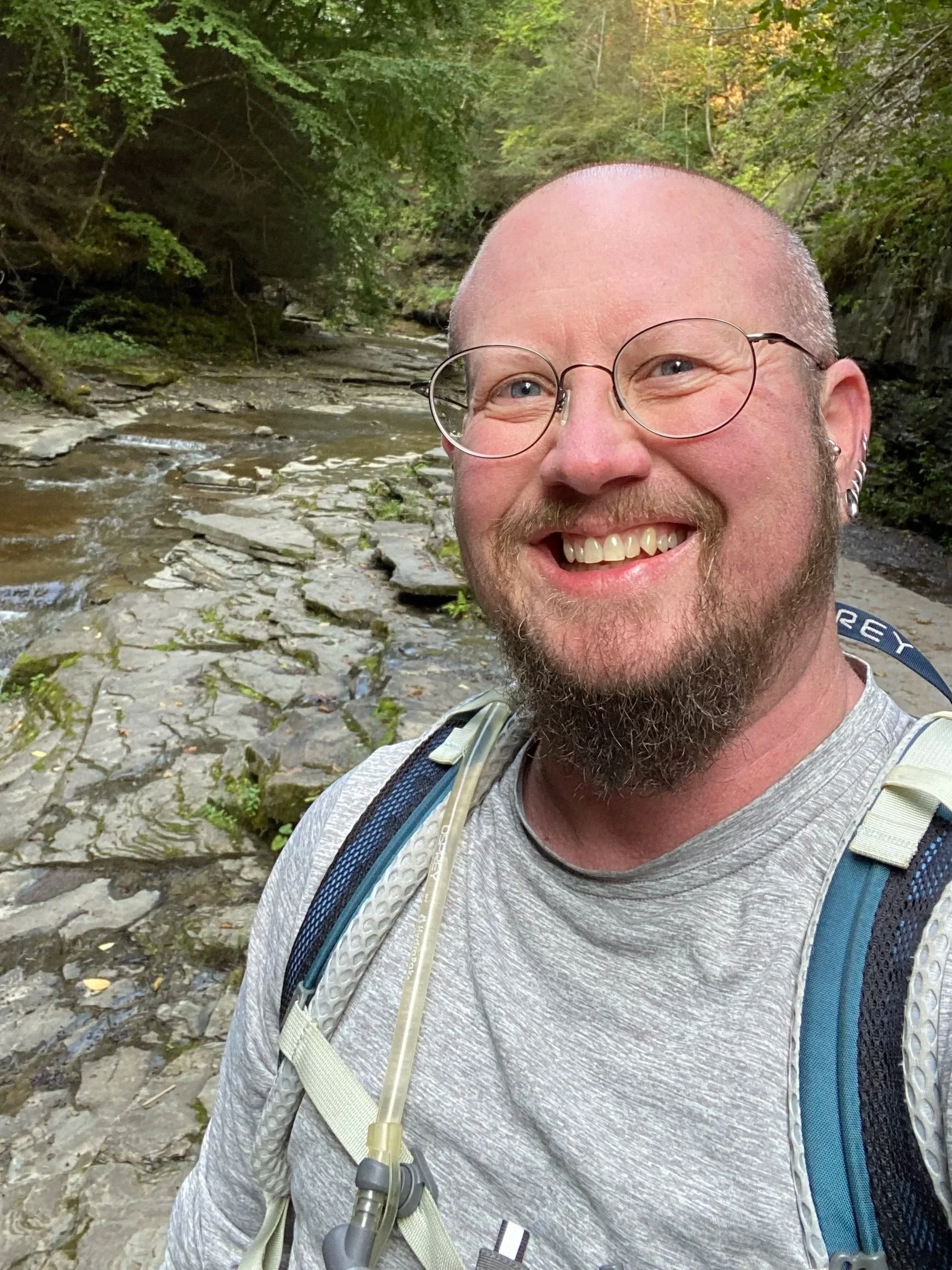 Image of Bear hiking by river