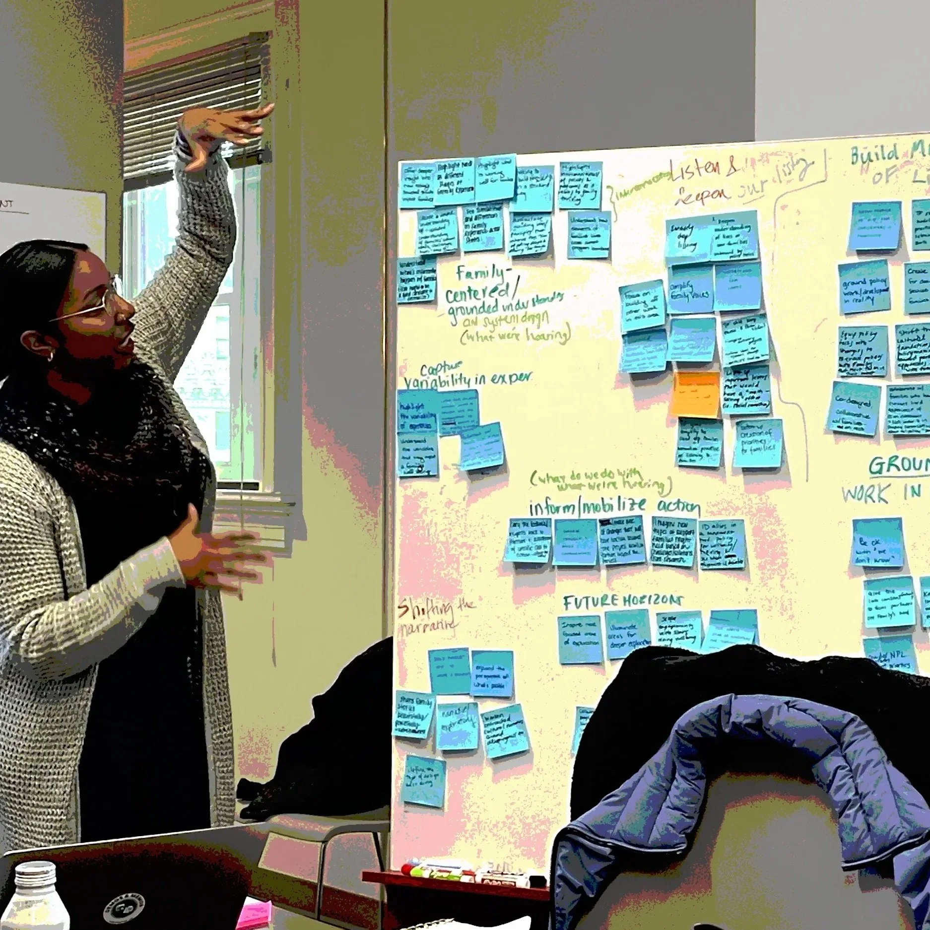 Keara, founder of The South Design Research Studio, synthesizing sticky notes with a research team