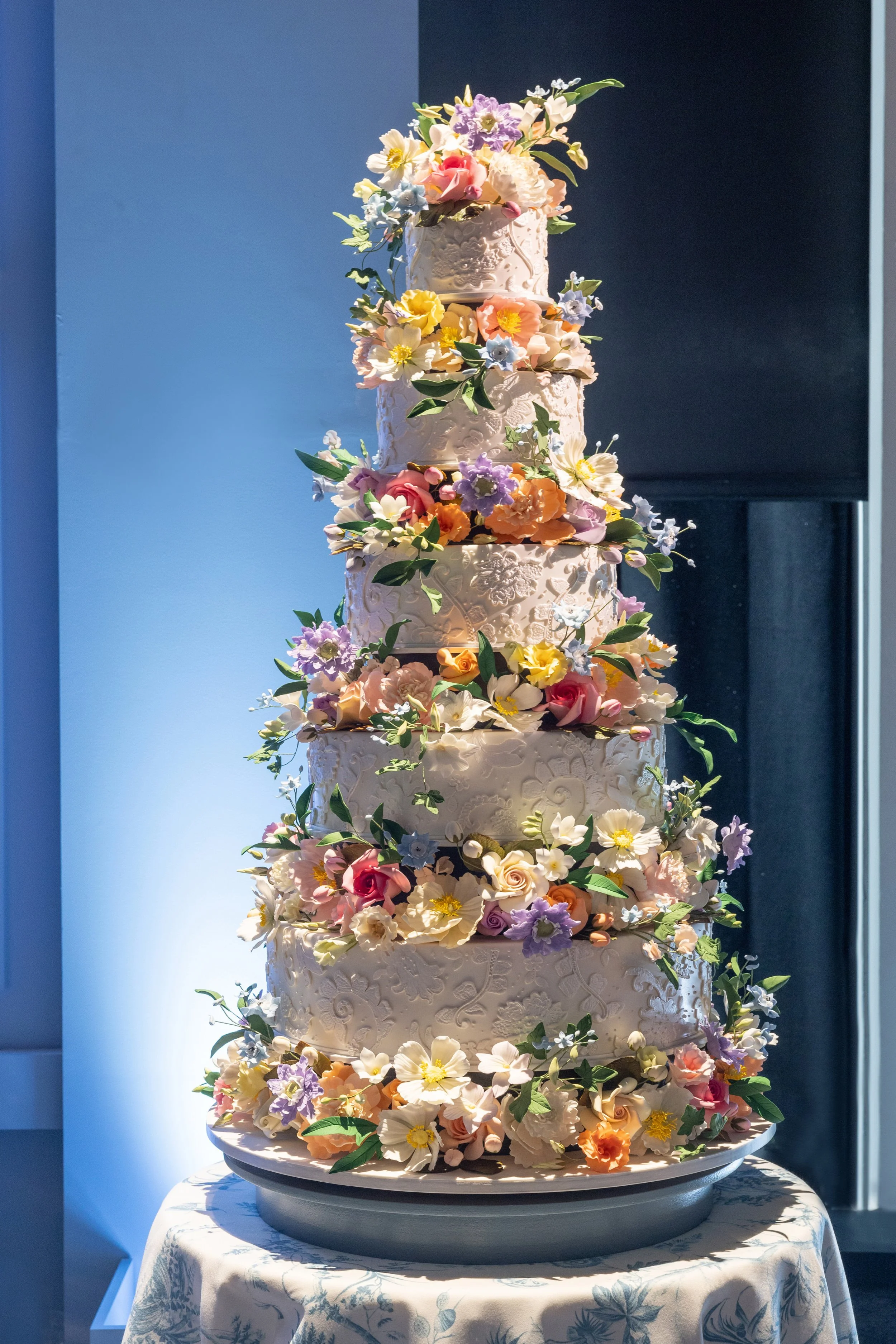 Custom floral wedding cake designed for a luxury wedding reception by Alisha Hope Productions