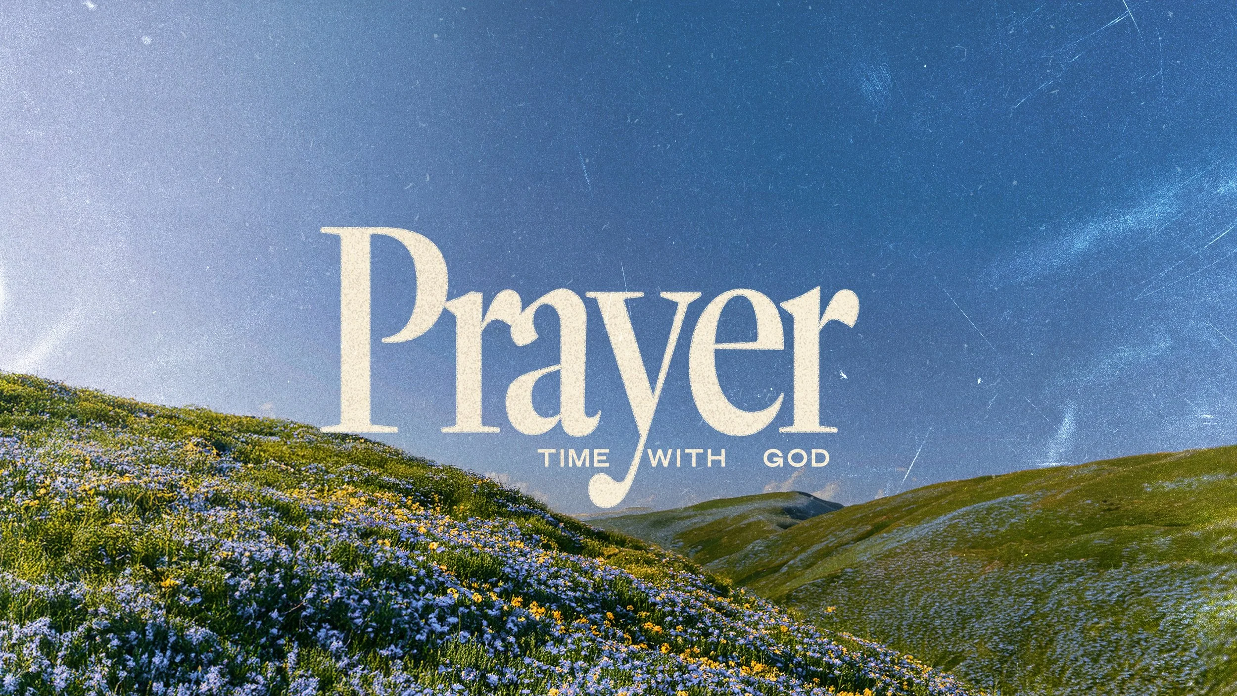 An image of hills and blue sky with the words 'Prayer' and 'Time with God' in the centre in a serif font.