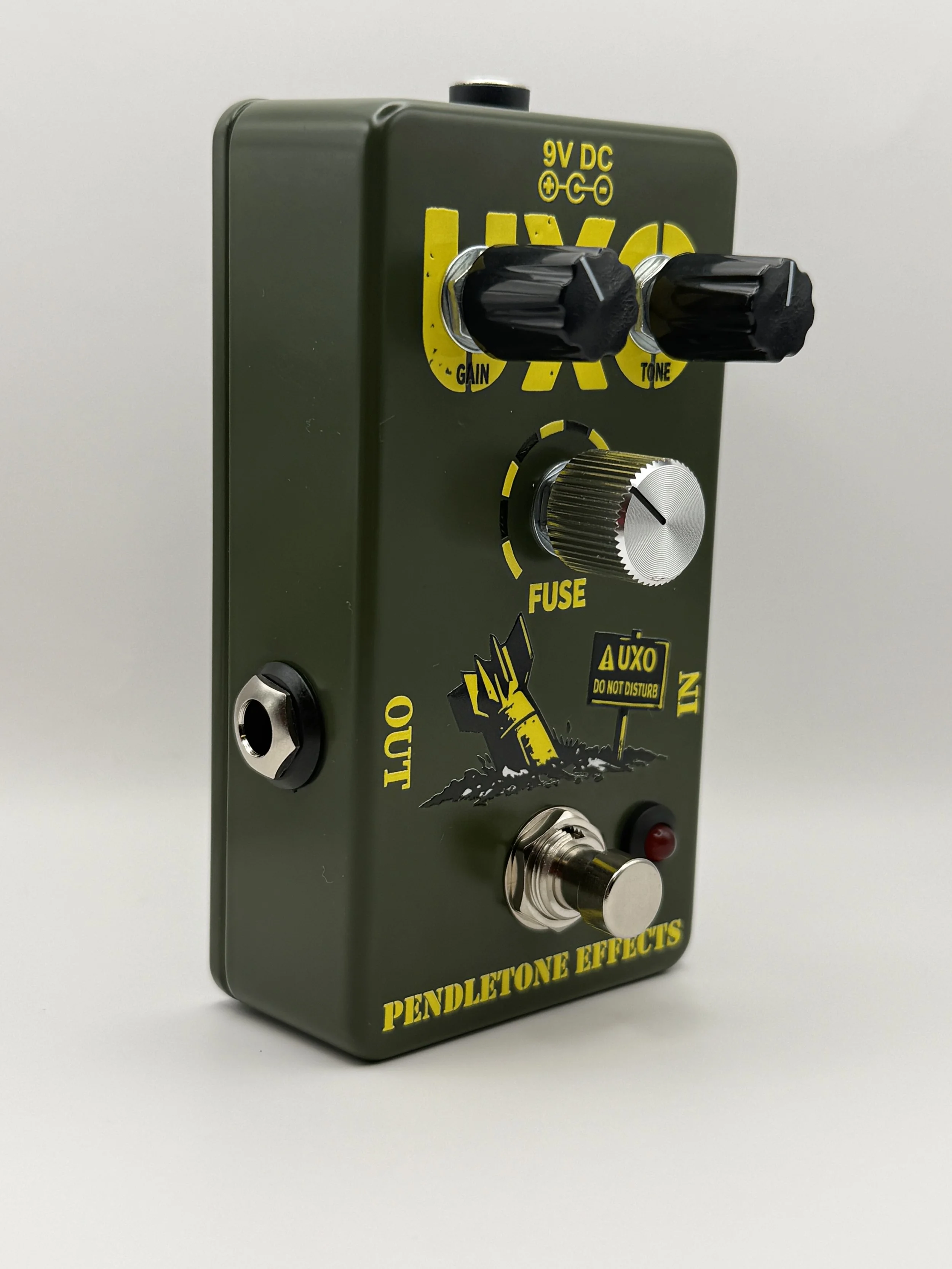 Angled view of the Pendletone Effects UXO overdrive pedal showing the Gain, Fuse, and Tone controls.