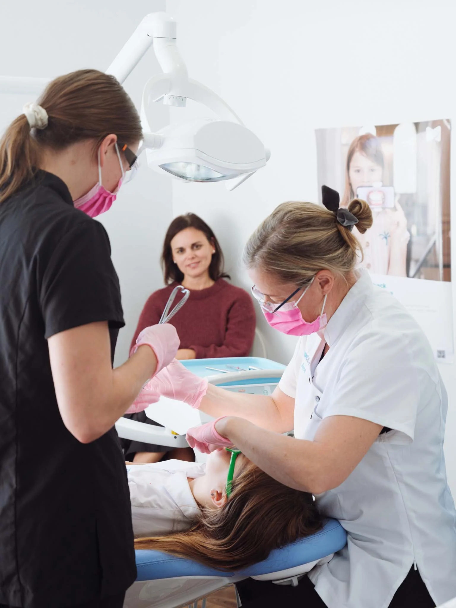 Anna Measures performs a procedure on a patient at Quin Dental, Nelson, New Zealand