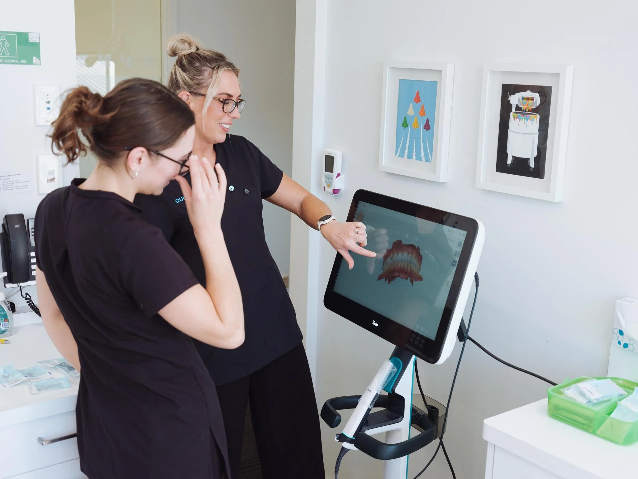 Dental assistants review scan at Quin Dental, Nelson