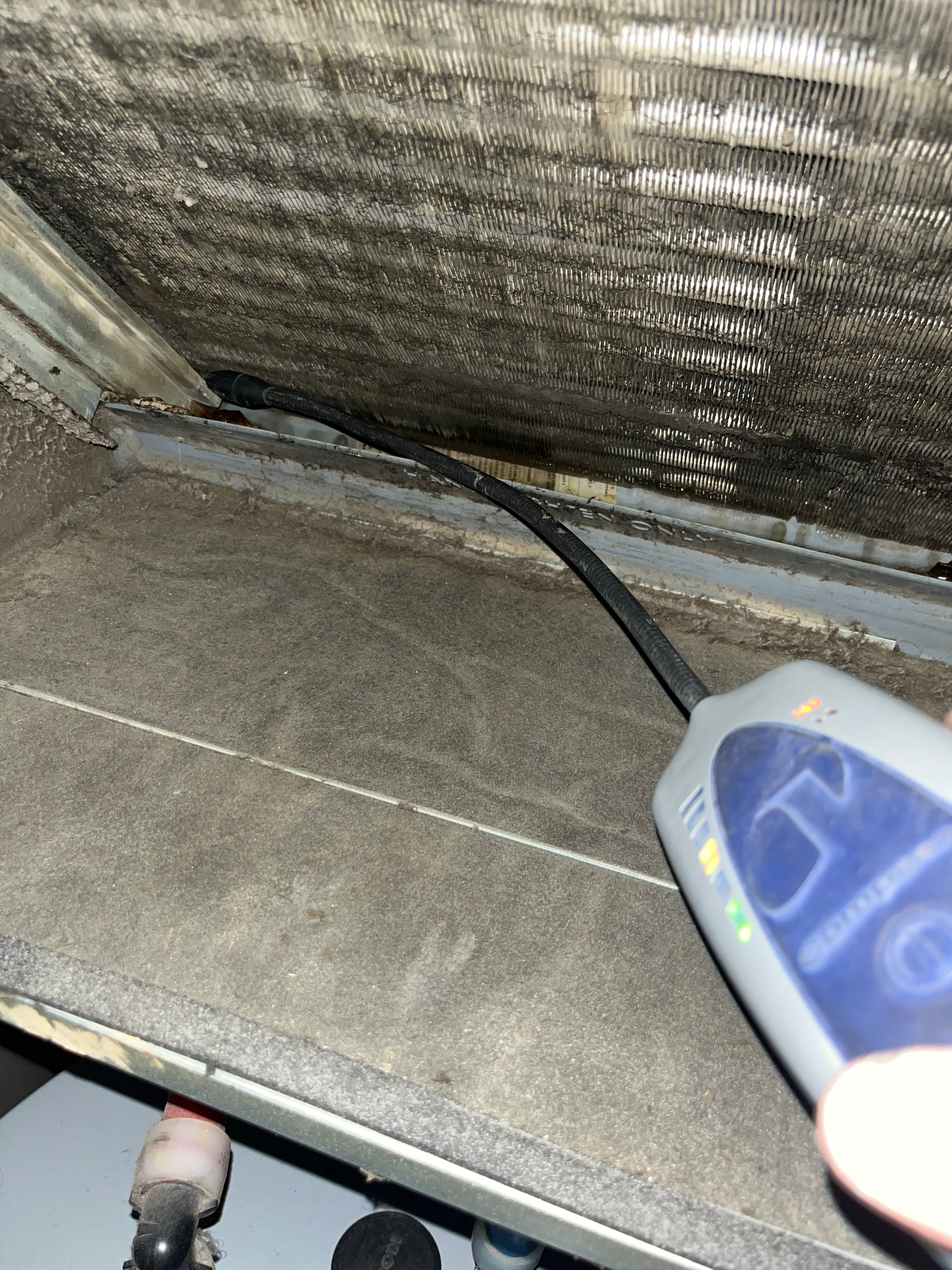 HVAC refrigerant leak detection service using electronic leak detection equipment during system diagnostics