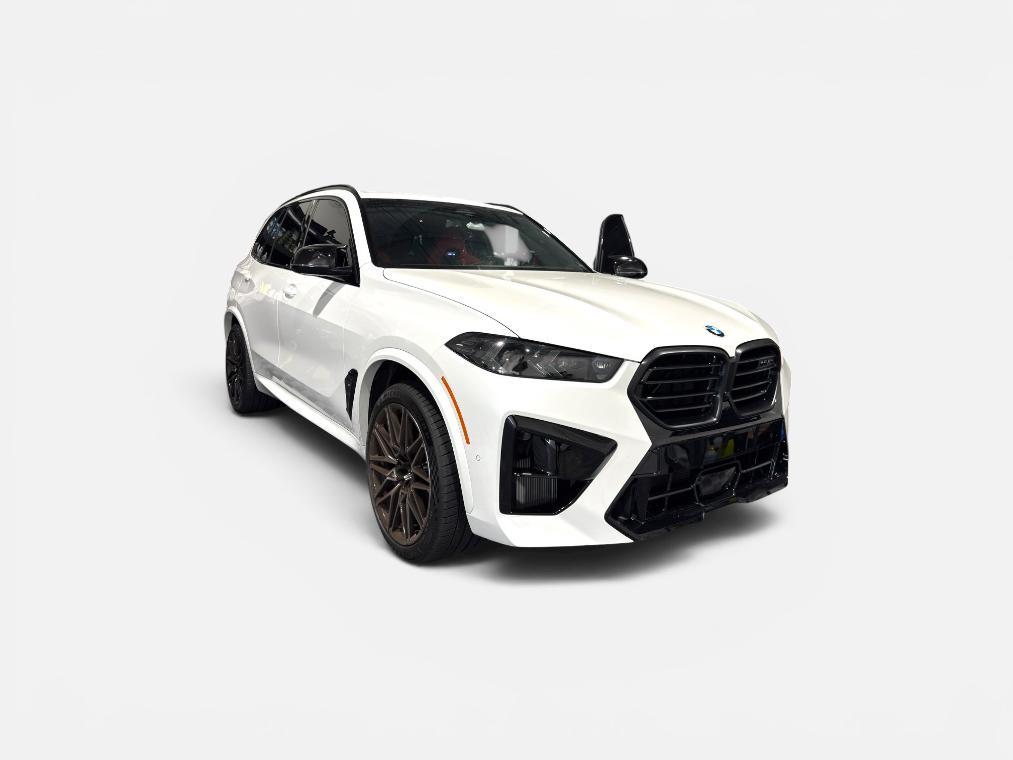 A white SUV with black accents and large black wheels, positioned against a plain white background.