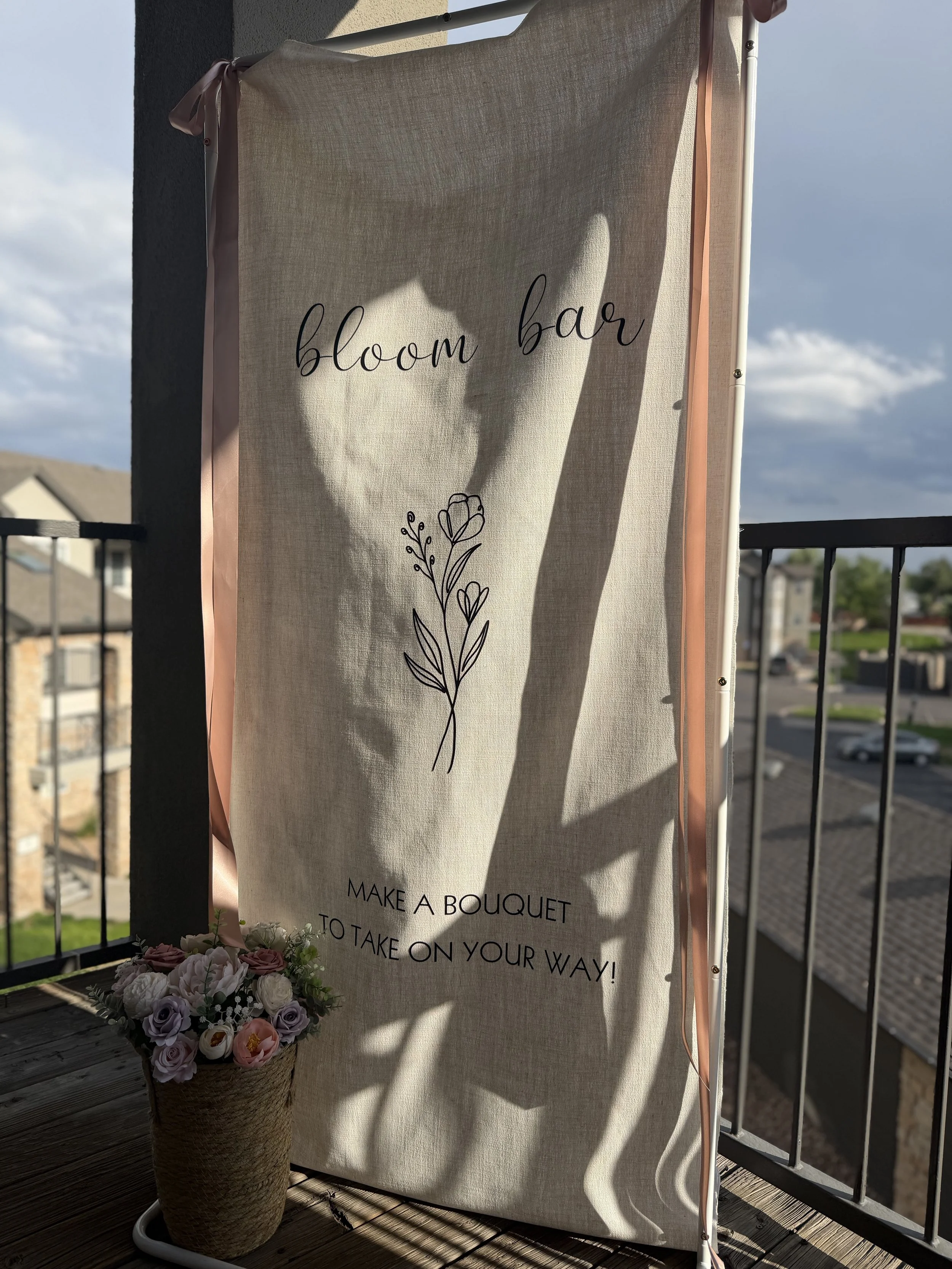 Heart-shaped shadow cast across a draped bloom bar backdrop in Colorado
