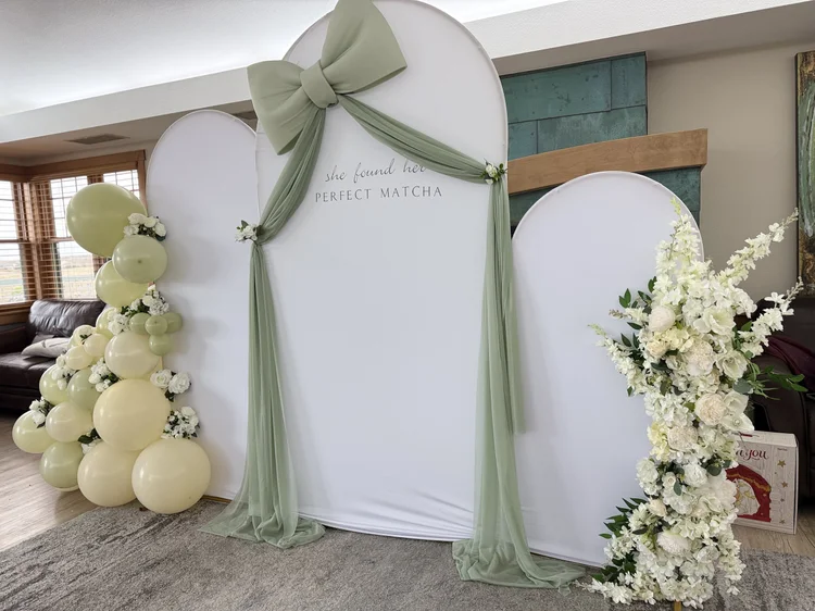 Outdoor draped arch with floral accents