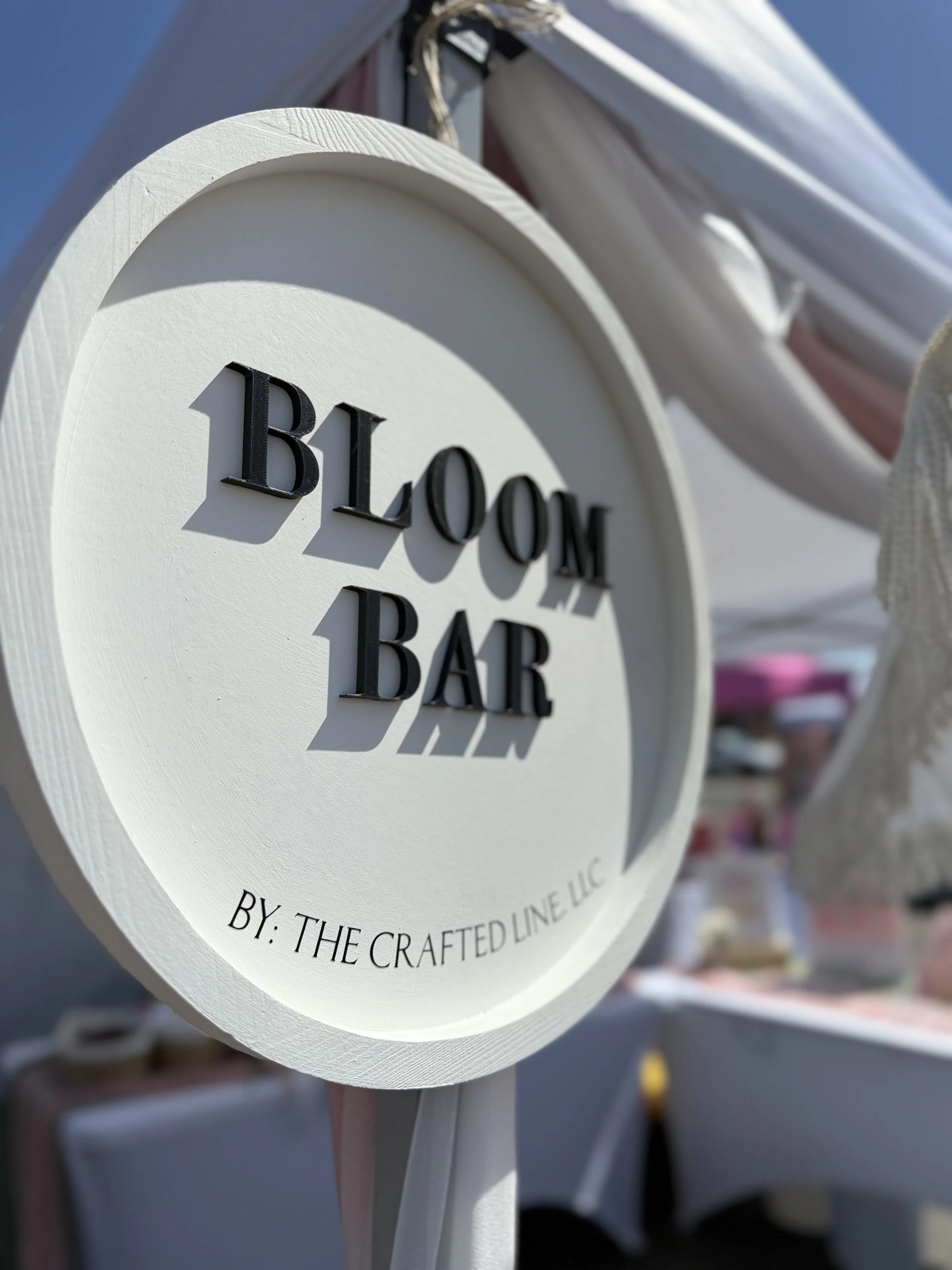 Round "Bloom Bar" tray signage by The Crafted Line in Colorado