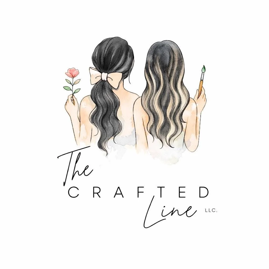 A watercolor illustration of two women with wavy hair, one holding a pink flower and the other holding a makeup brush. The image includes the text "The Crafted Line LLC."