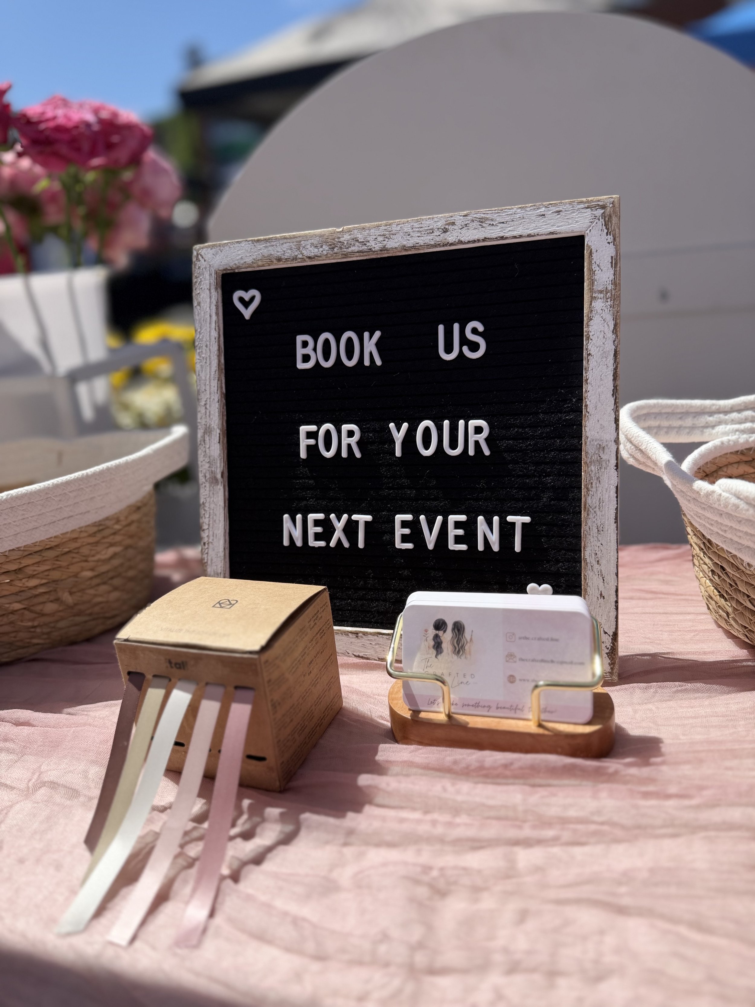 "Book us for your next event" letterboard sign at a Colorado bloom bar