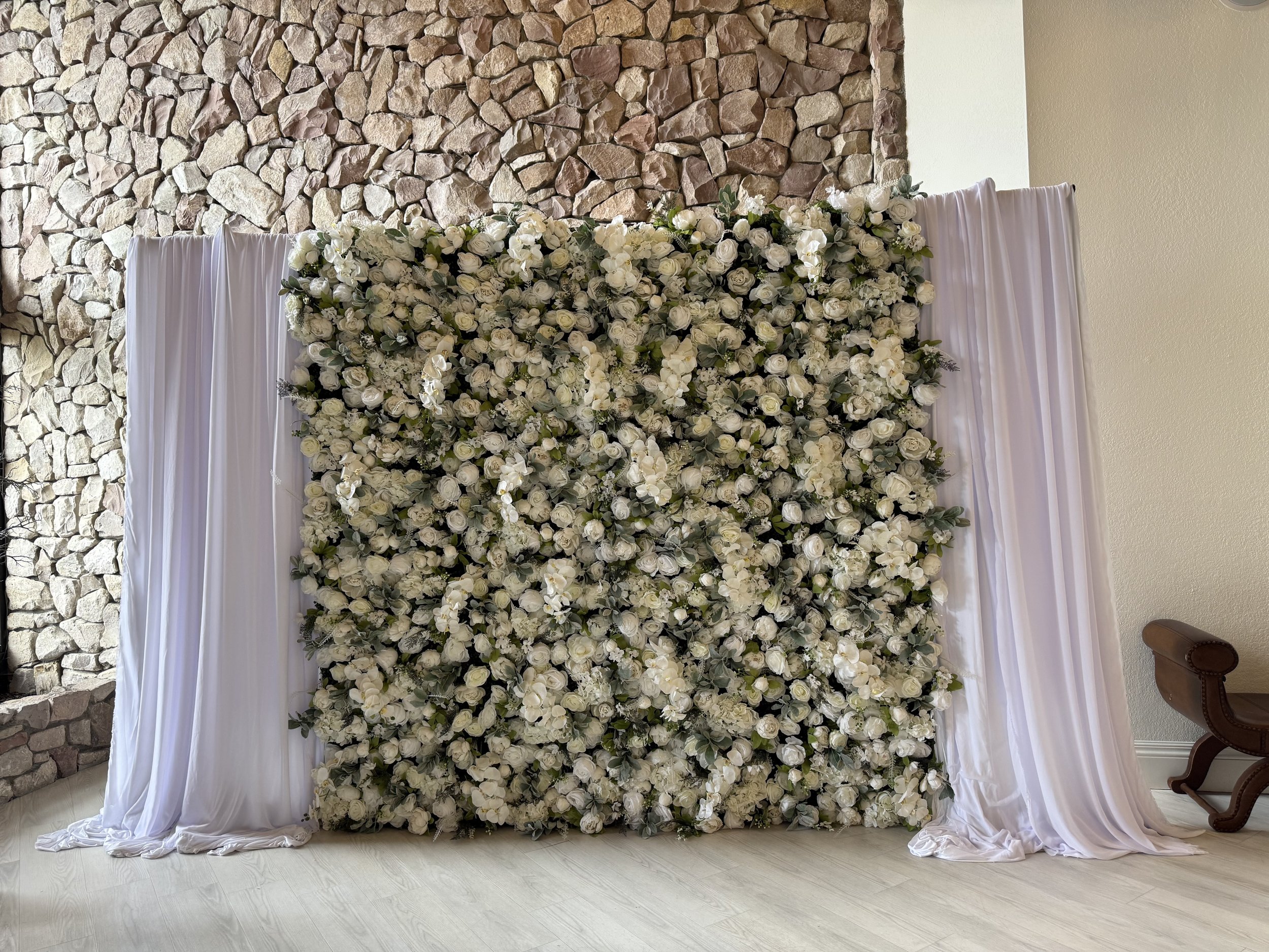 Blush and cream floral wall backdrop with draping rental in Colorado