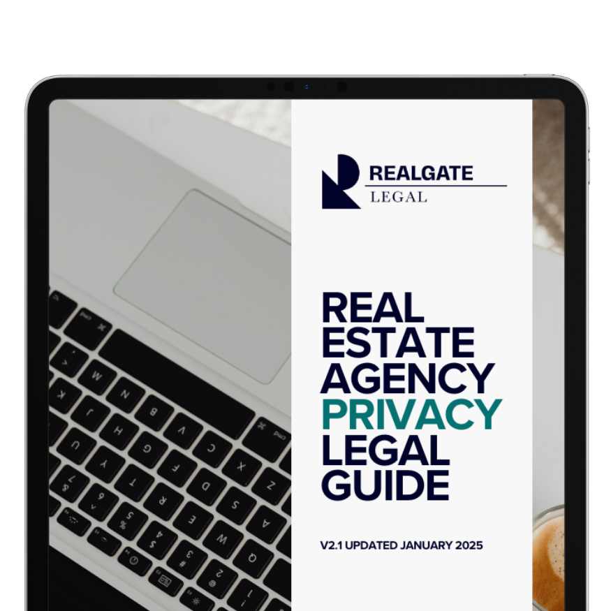 Cover of a legal guide titled 'Real Estate Agency Privacy Legal Guide' on a tablet screen, with a partial view of a laptop keyboard and a coffee cup.
