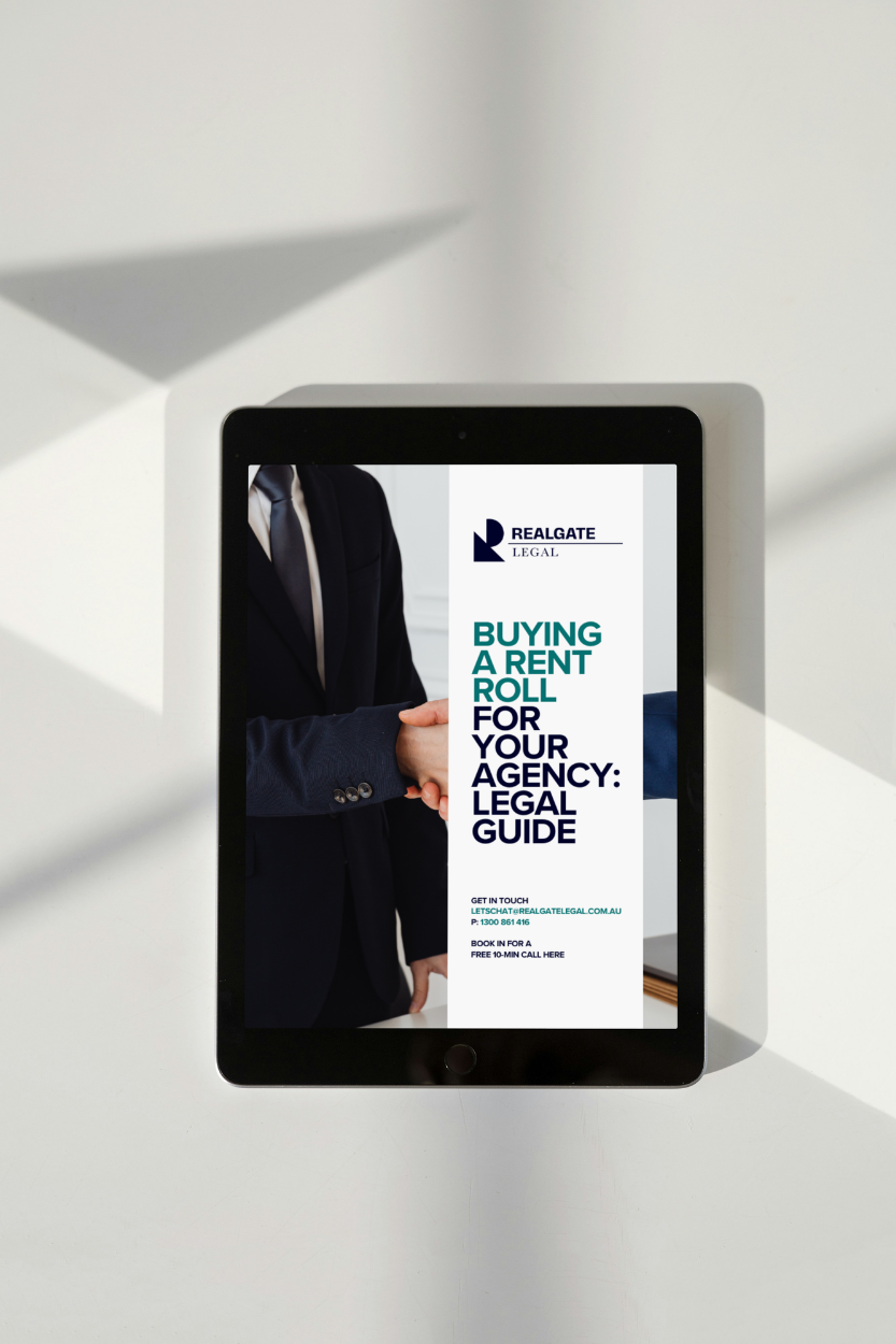 A tablet displaying a legal guide about buying a rent roll for an agency, featuring a handshake image and contact information for RealGATE Legal.