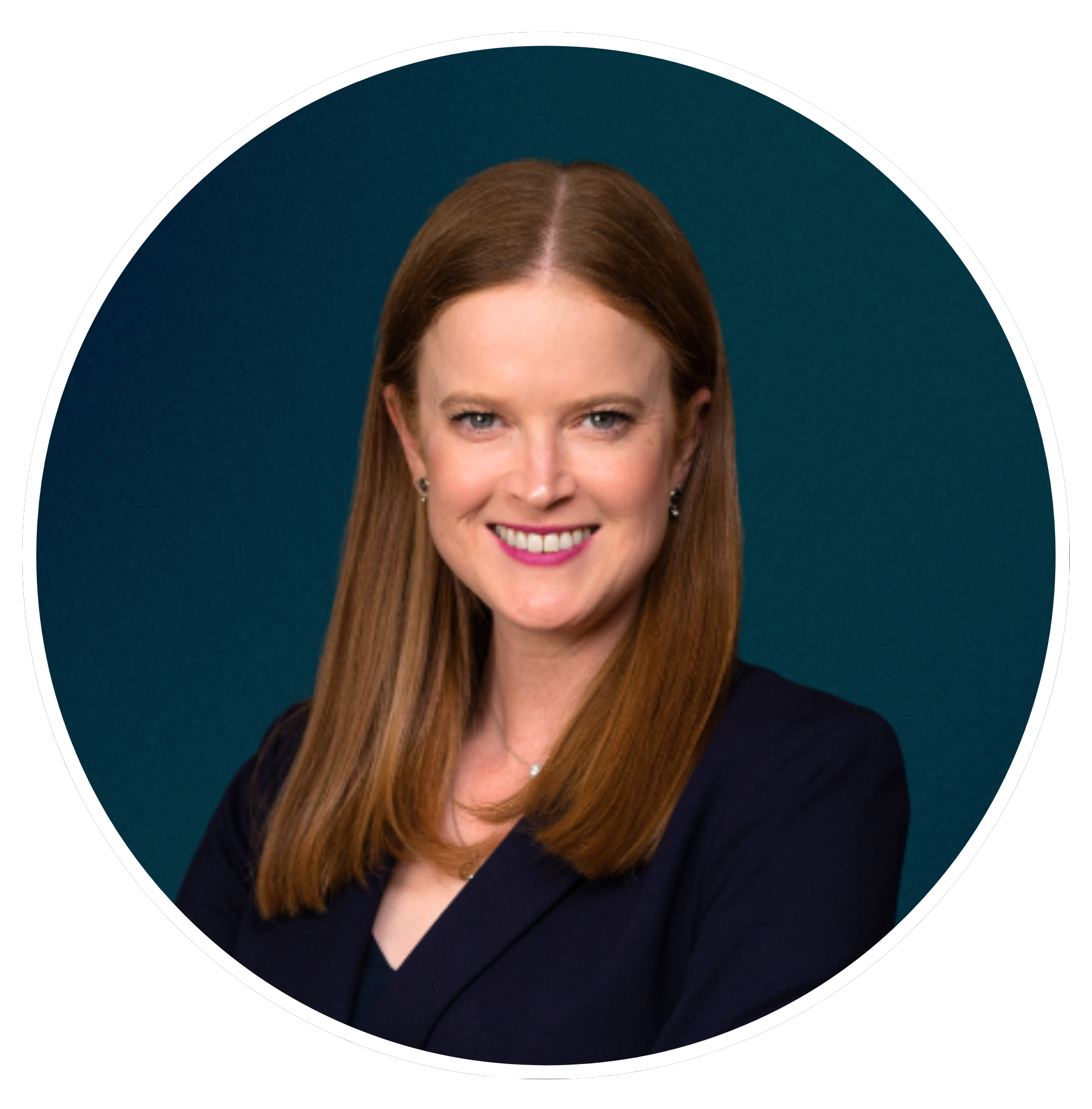 Close-up of a smiling woman with long red hair, wearing a black top and earrings, against a teal background.