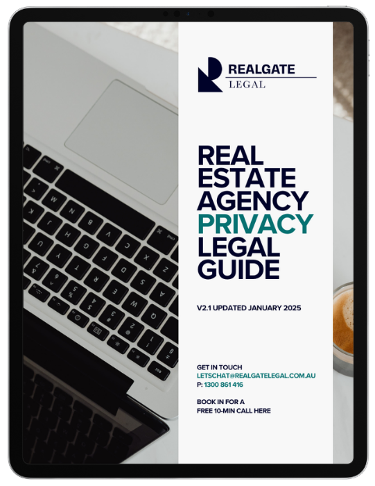 Open laptop with a brochure on real estate agency privacy legal guide on the screen.