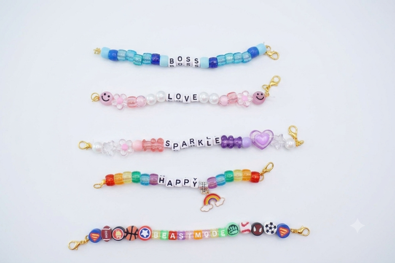 Five colorful beaded bracelet charms arranged in a vertical line, each with different themes and colors.