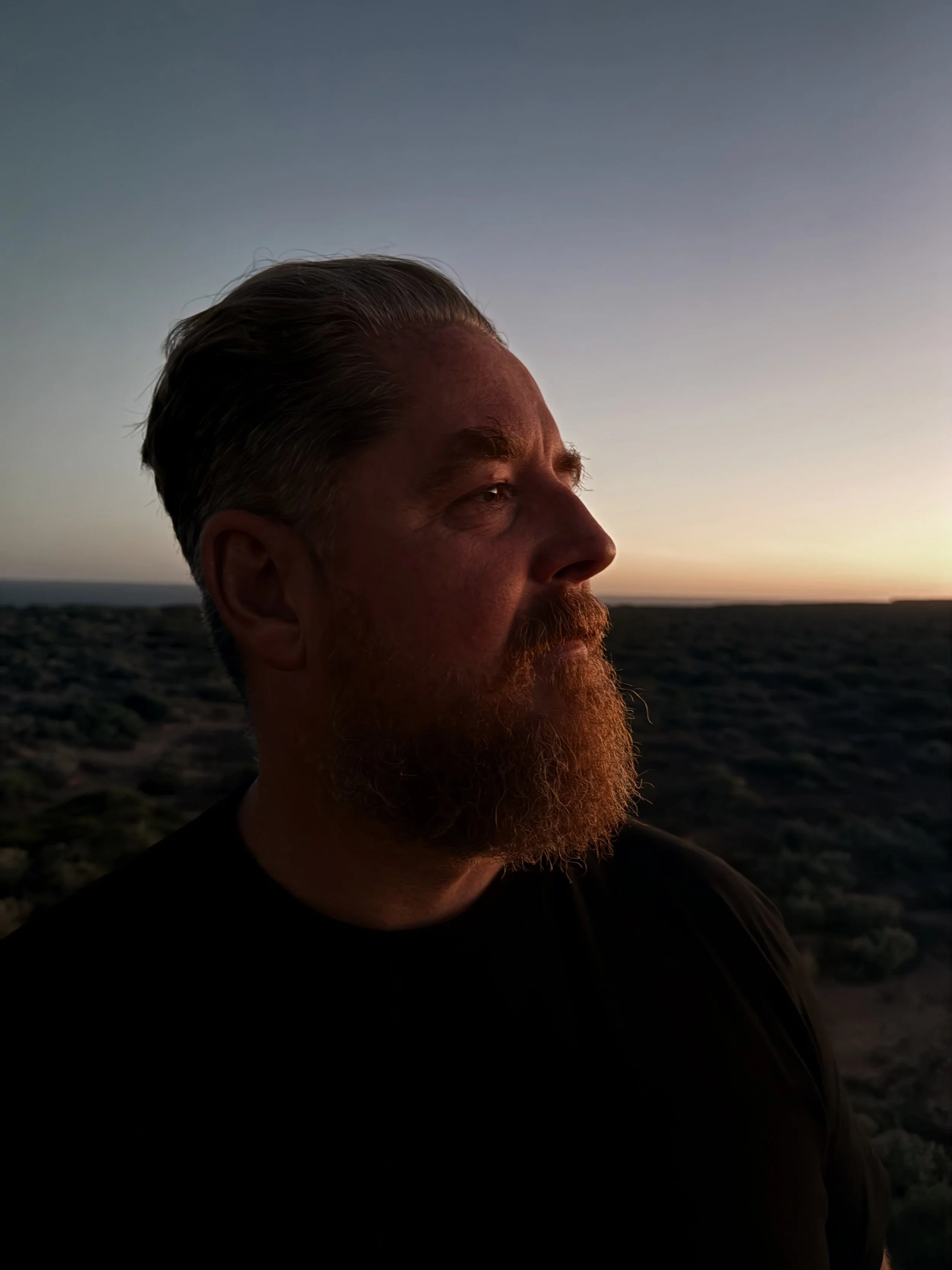 Brendan looking right over the plains at sunset.