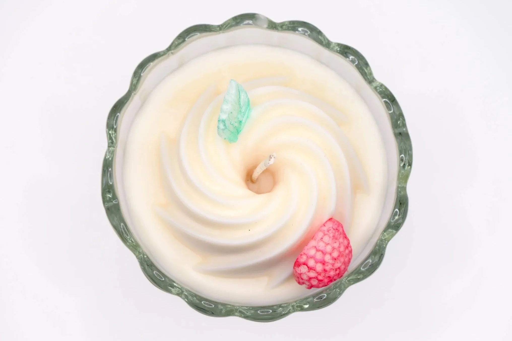 Curious Confections Strawberry Cheesecake candle featuring sweet strawberry, creamy vanilla, and bakery-inspired fragrance notes in a handcrafted dessert candle design..