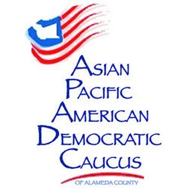 Logo for the Asian Pacific American Democratic Caucus of Alameda County, featuring a stylized map with red and white stripes and a blue shape, along with blue text.