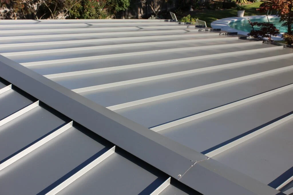 Metal roof on a Central Texas home, the catchment surface for a rainwater harvesting system