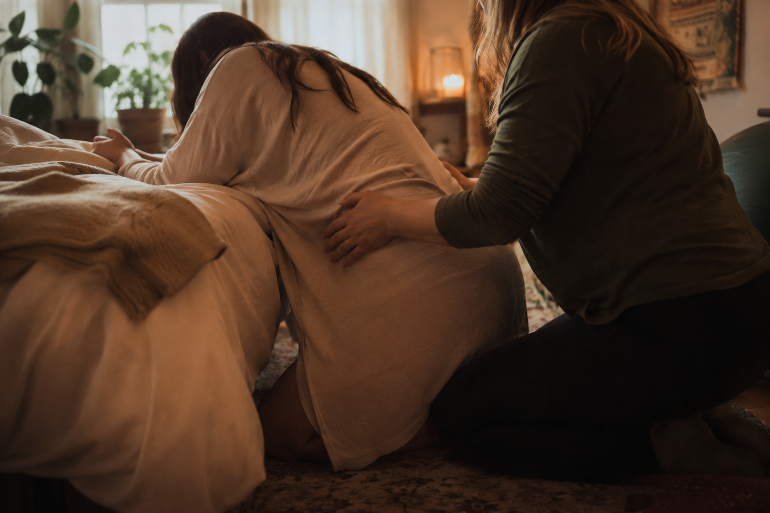 Woman Laboring with doula support, soft background, humboldt county