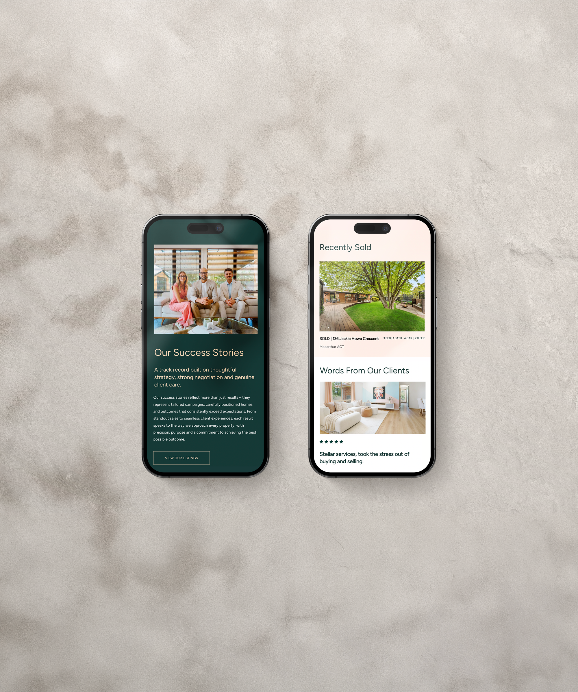 Two smartphones placed side by side on a light-colored textured surface displaying real estate listings and success stories.