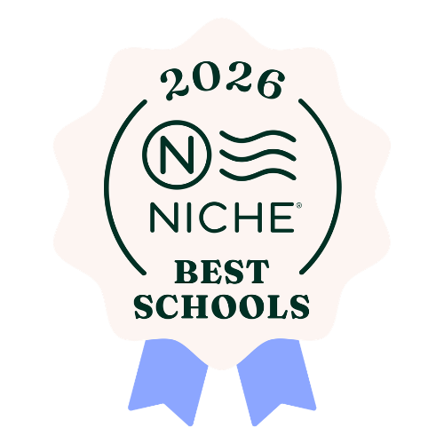 A badge with a white scalloped border, green text, and two blue ribbons at the bottom. It reads '2026 NICHE BEST SCHOOLS' with a stylized 'N' and waves inside a circle at the top.