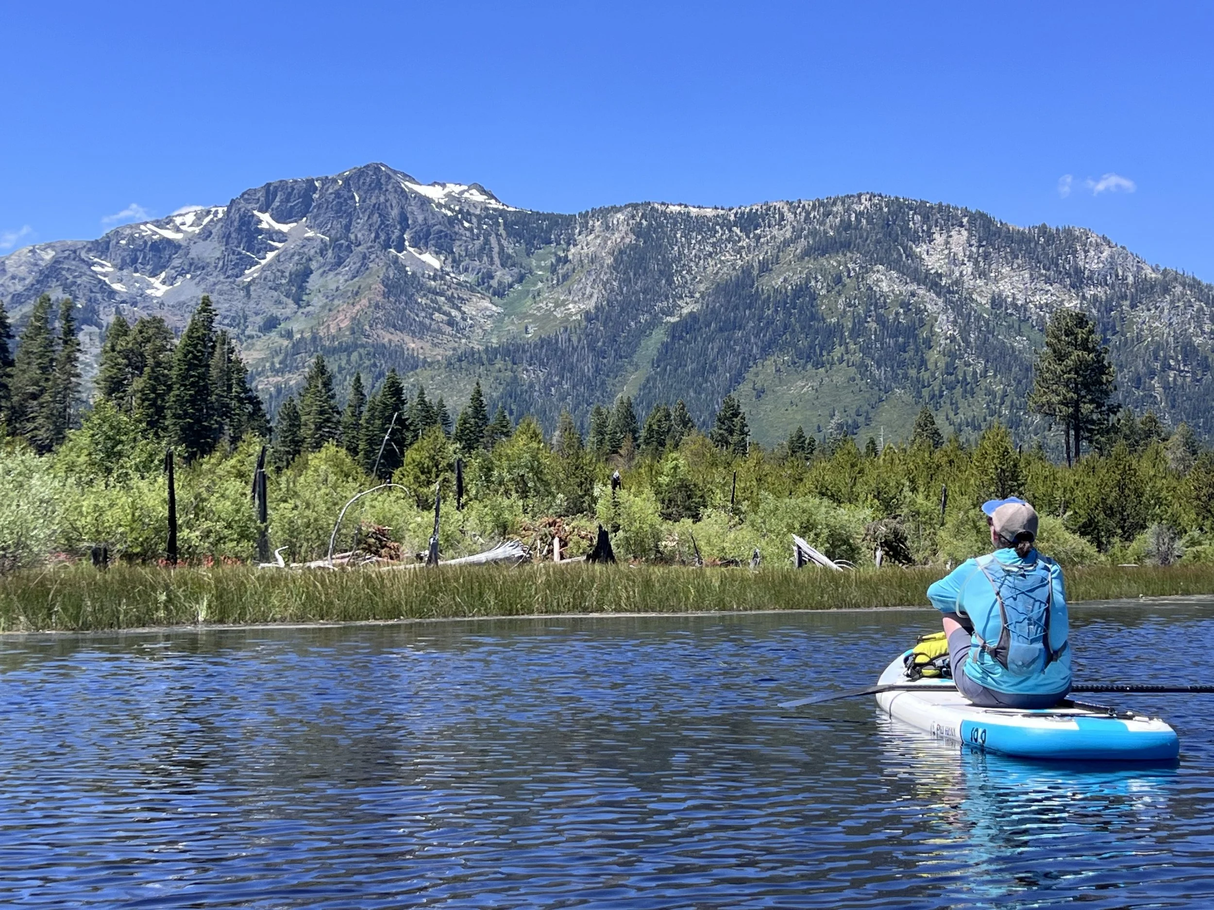 mountain Lake Tahoe scene stand-up paddle boarder foreground