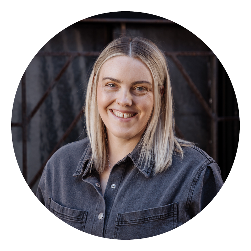 Ashleigh from the Brenda Nom team, with long blonde hair, wearing a dark denim shirt.