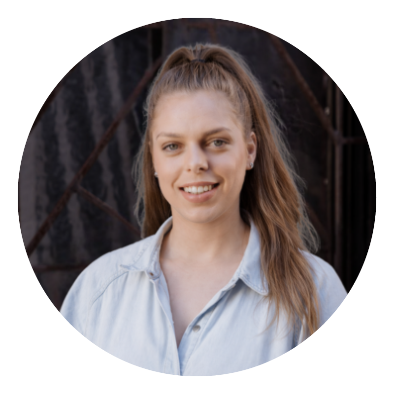 Lu from the Brenda Nom team, with her hair in a high ponytail, wearing a light blue shirt.
