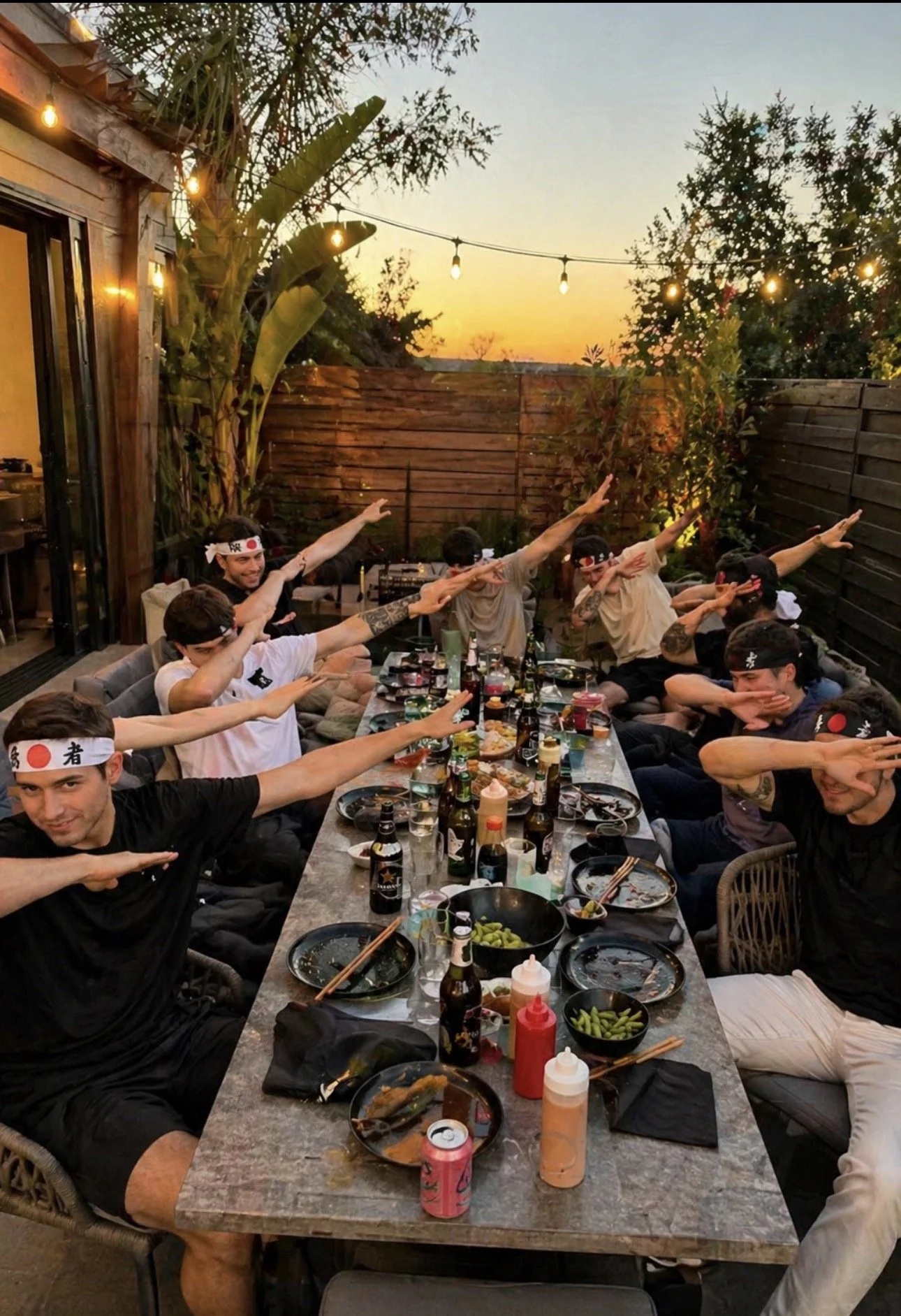 Fun and interactive Backyard Hibachi dining experience, showcasing the high-energy atmosphere of our Bachelor Party, Bachelorette Party, and Birthday Party services.