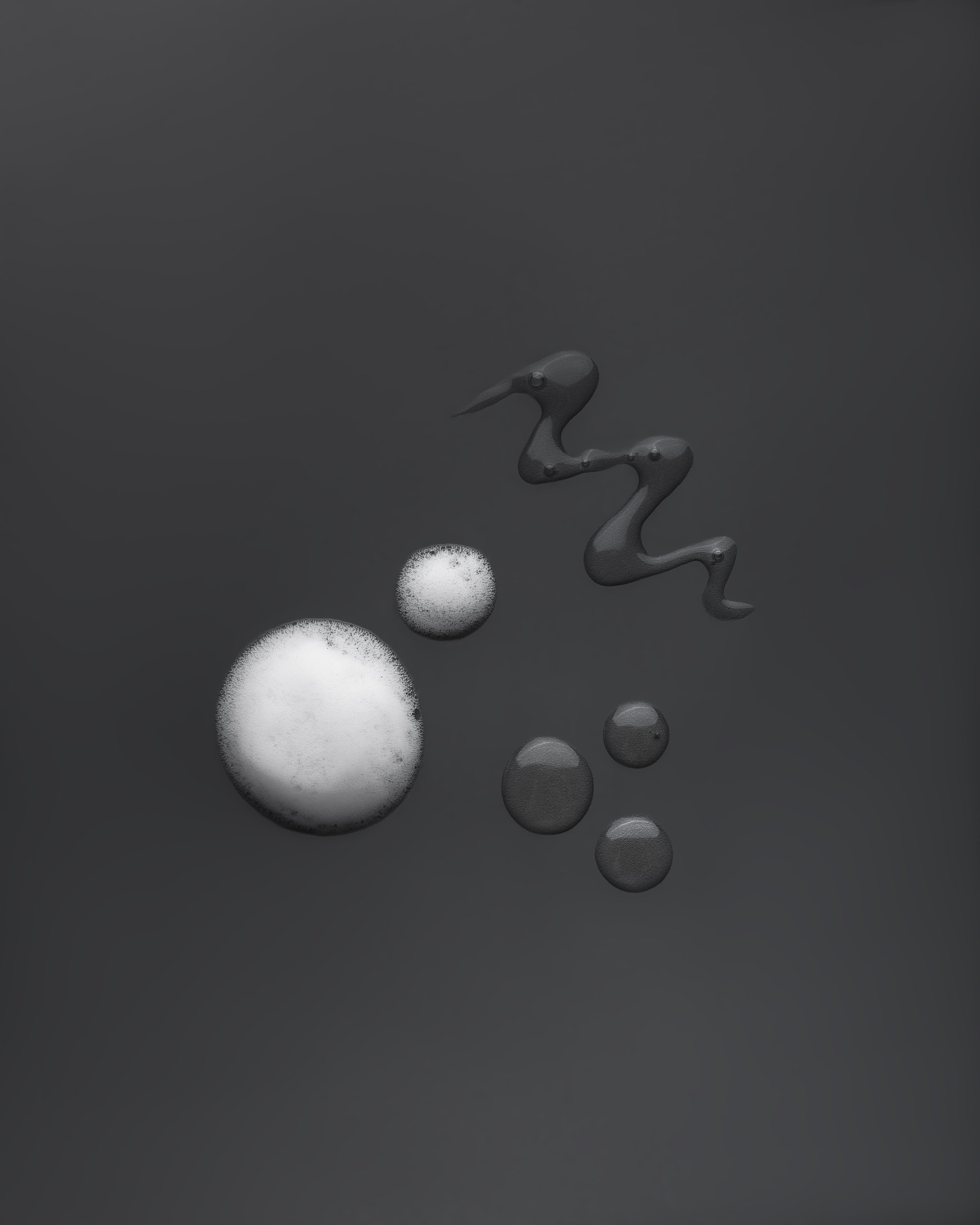 Close-up of a foamy cream texture in varying droplet sizes alongside a squiggled gel texture, set against a dark charcoal background.