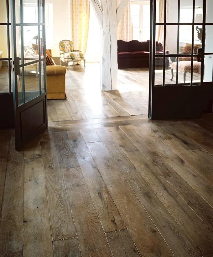 Antique oak flooring boards with aged texture in a rustic interior