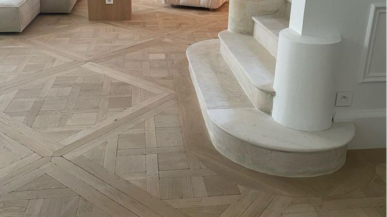 Reclaimed European oak parquet flooring showing a decorative patterned design, natural grain and refined interior detail.