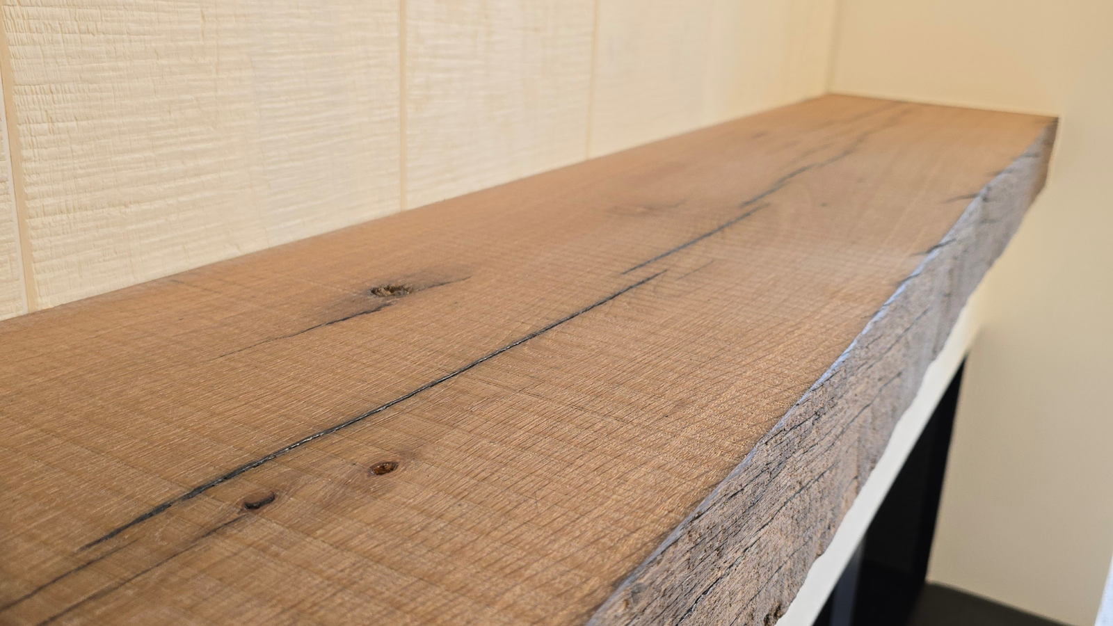 Reclaimed European oak fire mantel with natural grain, aged texture and rustic character.