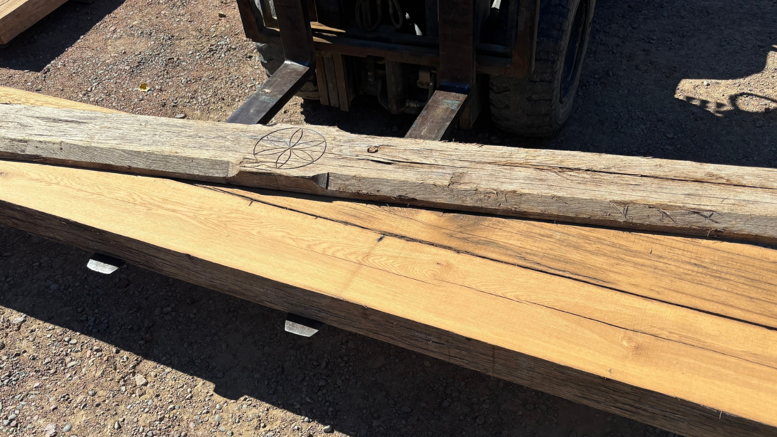 Reclaimed oak architectural beams with aged grain, weathered texture and natural historic character.