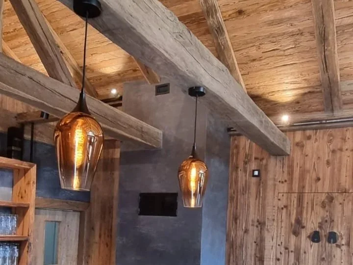 Interior of a rustic barn with wooden beams, wooden walls, 