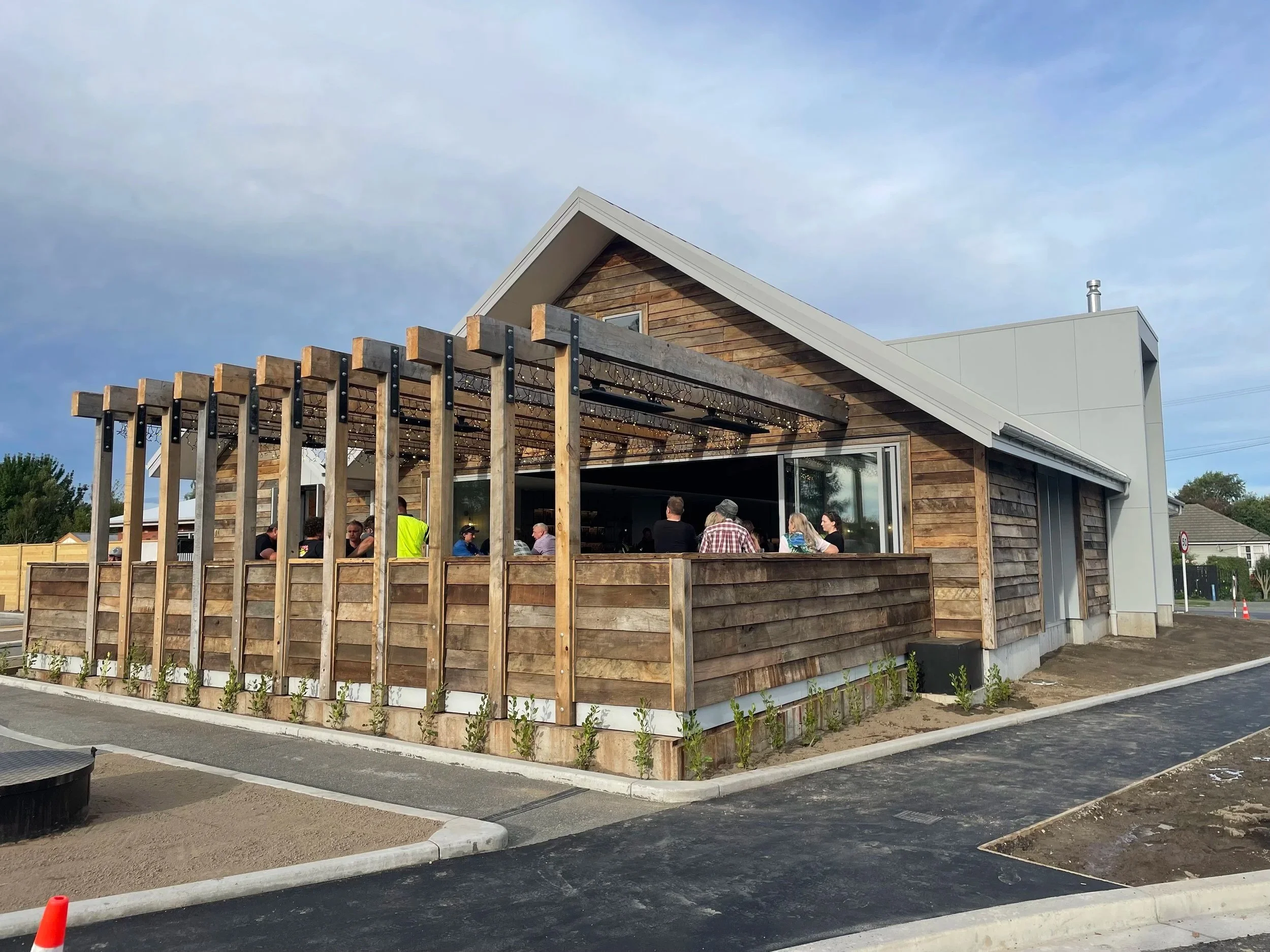 A modern building with rustic wooden cladding. 
