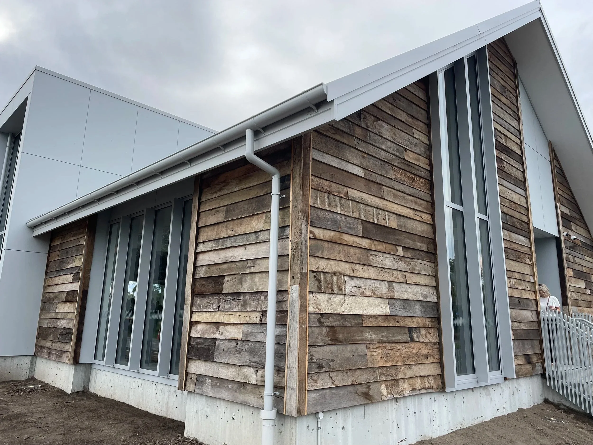 Modern house exterior with rustic cladding