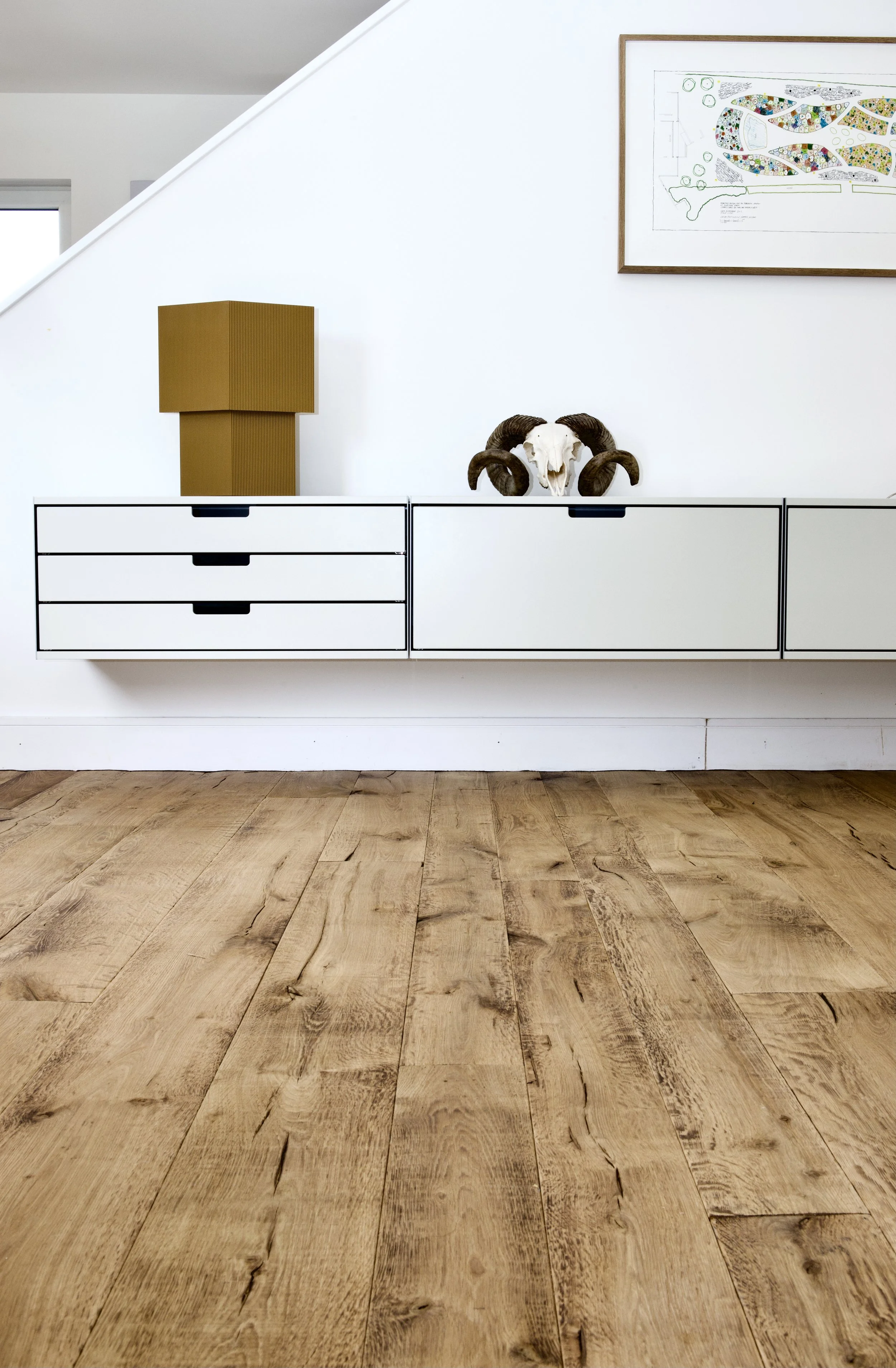 Textured reclaimed oak flooring with pronounced character and natural variation
