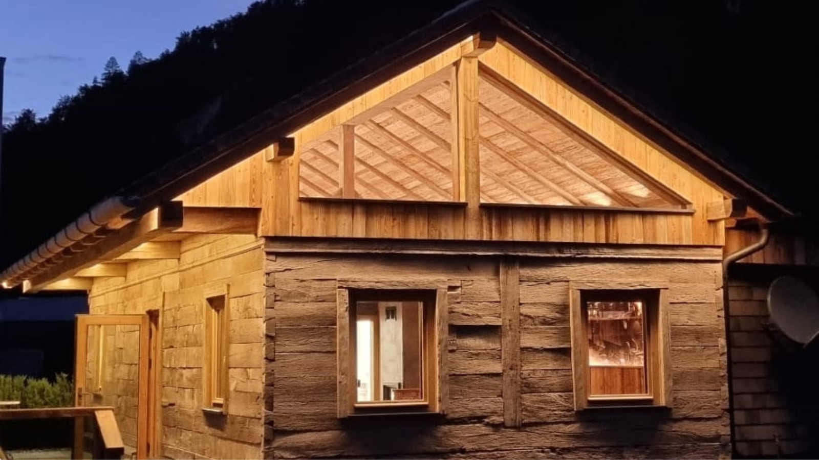 Reclaimed European oak exterior cladding on a timber house, showing aged boards, natural patina and rustic character.