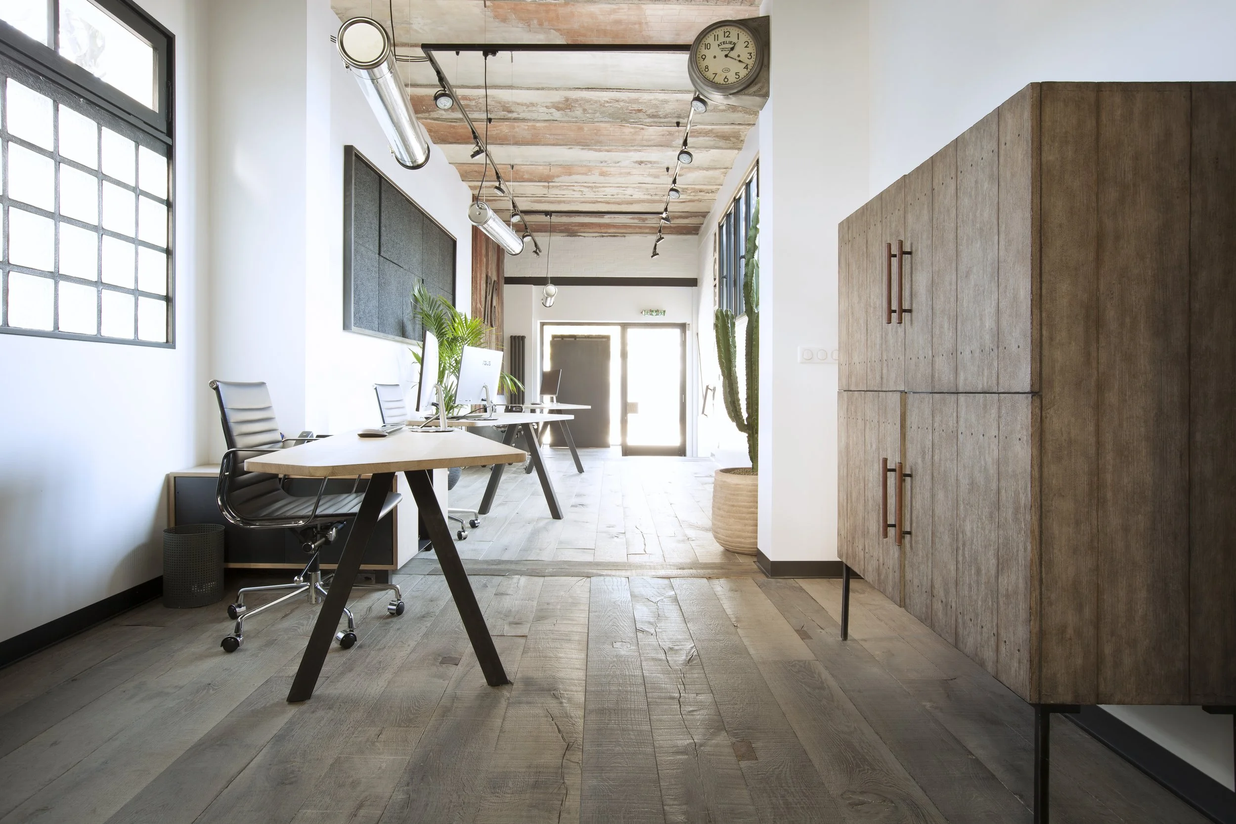 Antique oak flooring in a bright modern office interior
