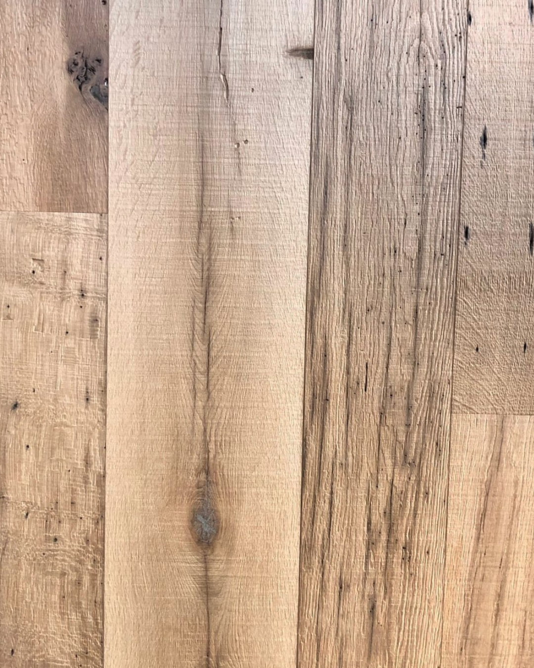 Close-up of a wooden surface with natural wood grain and knots.