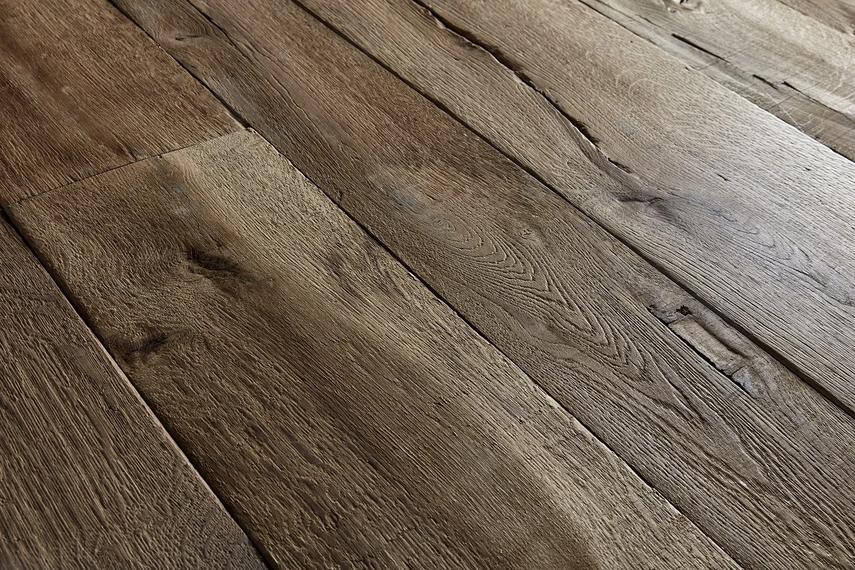 Rustic wooden floorboards with visible grain and natural texture.