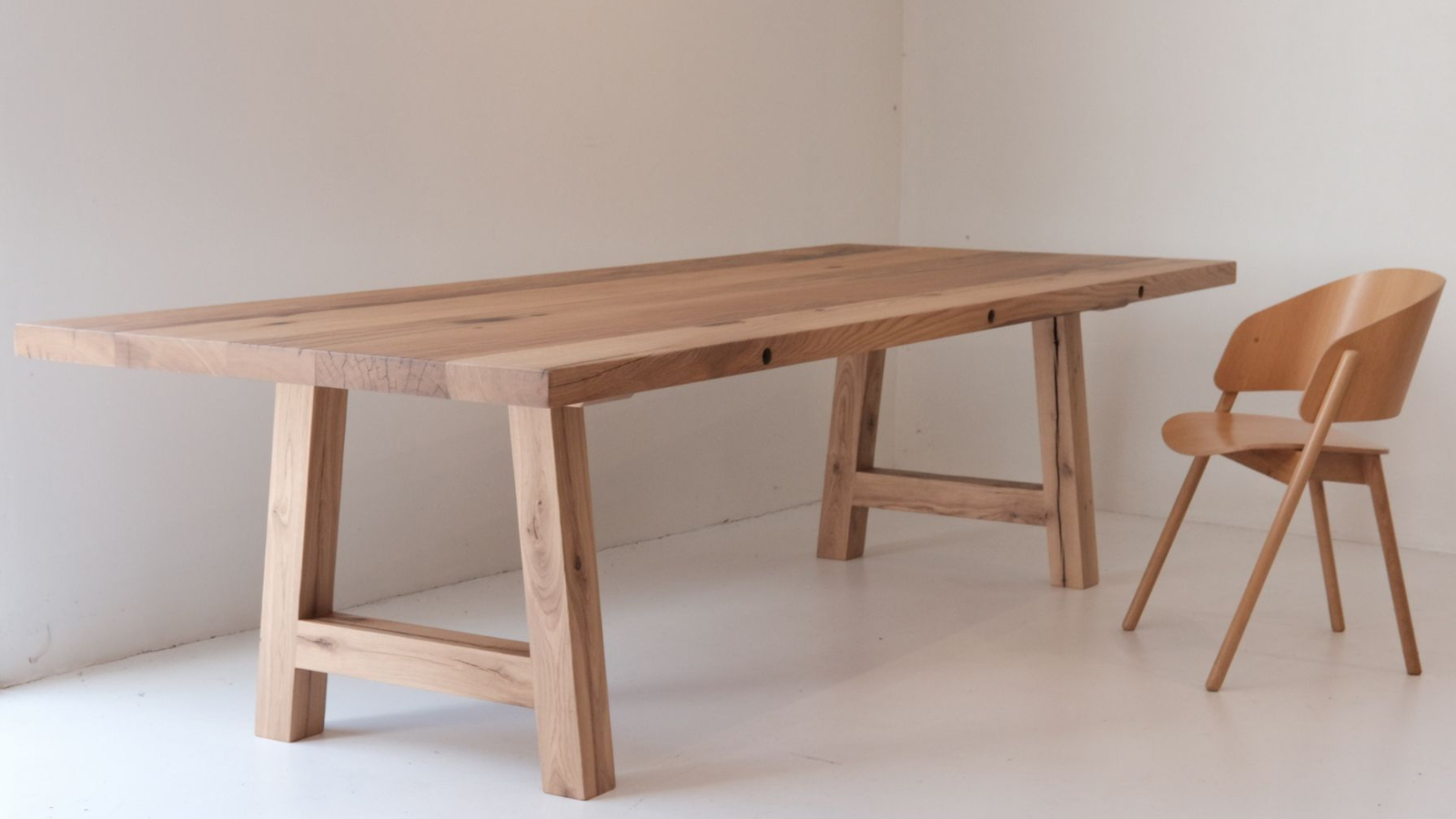 Reclaimed European oak dining table with natural grain, aged character and a clean modern design. Another good option: