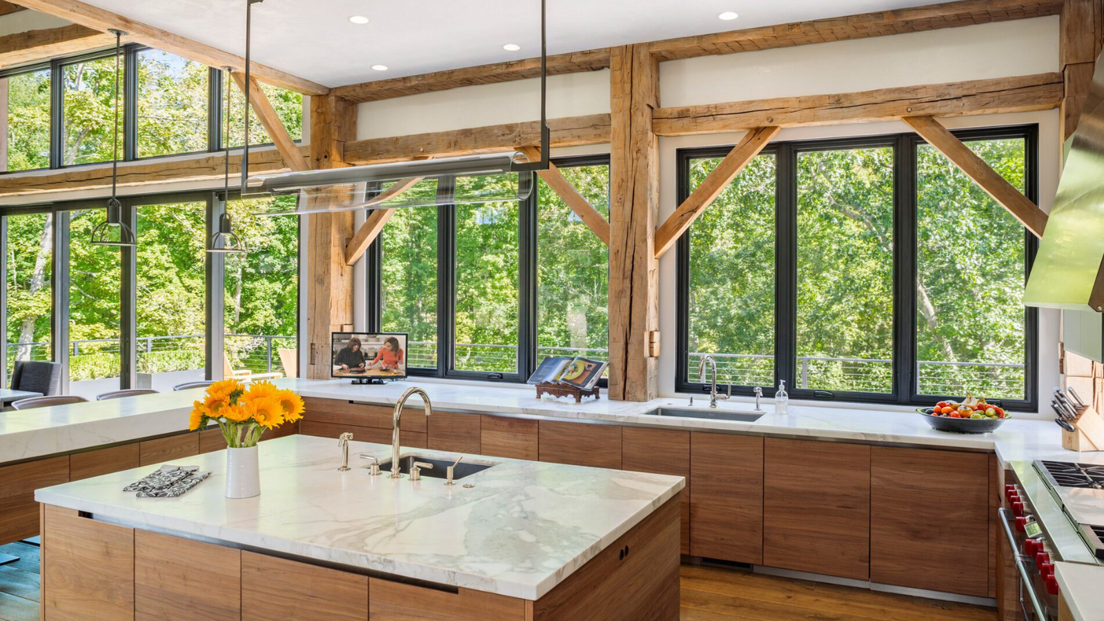 Antique European oak beams and vintage French oak flooring in a modern kitchen interior with natural light and timber detailing.